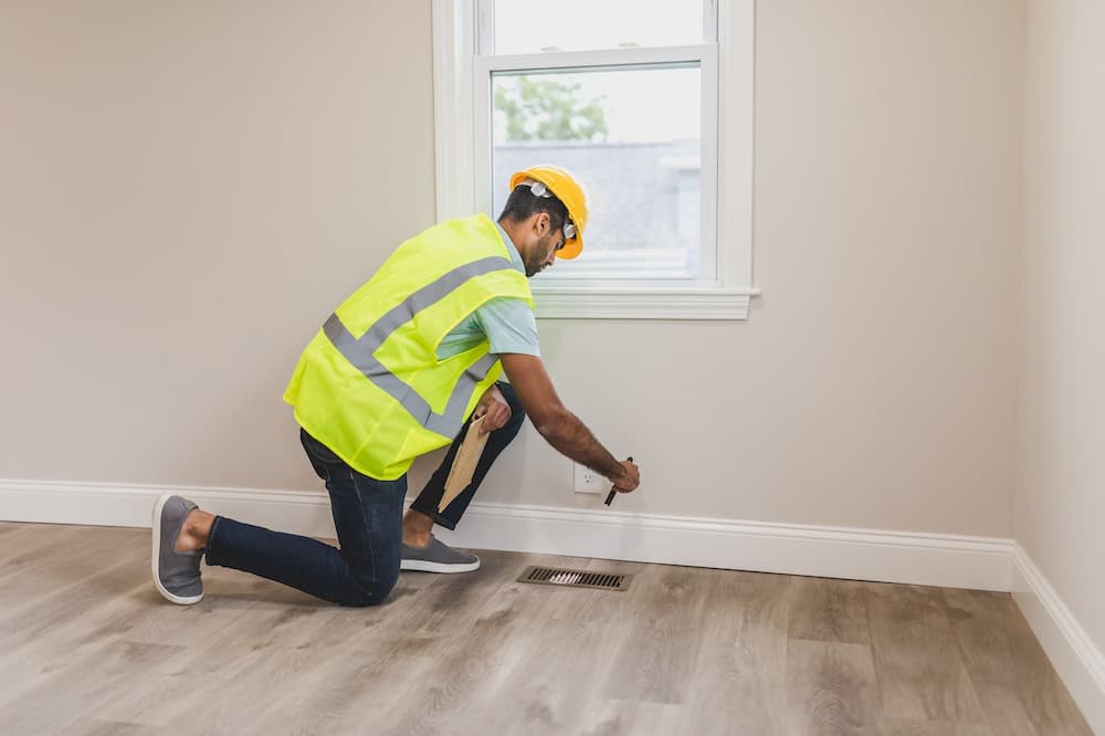 finishing touches on electrical outlet in new rrom