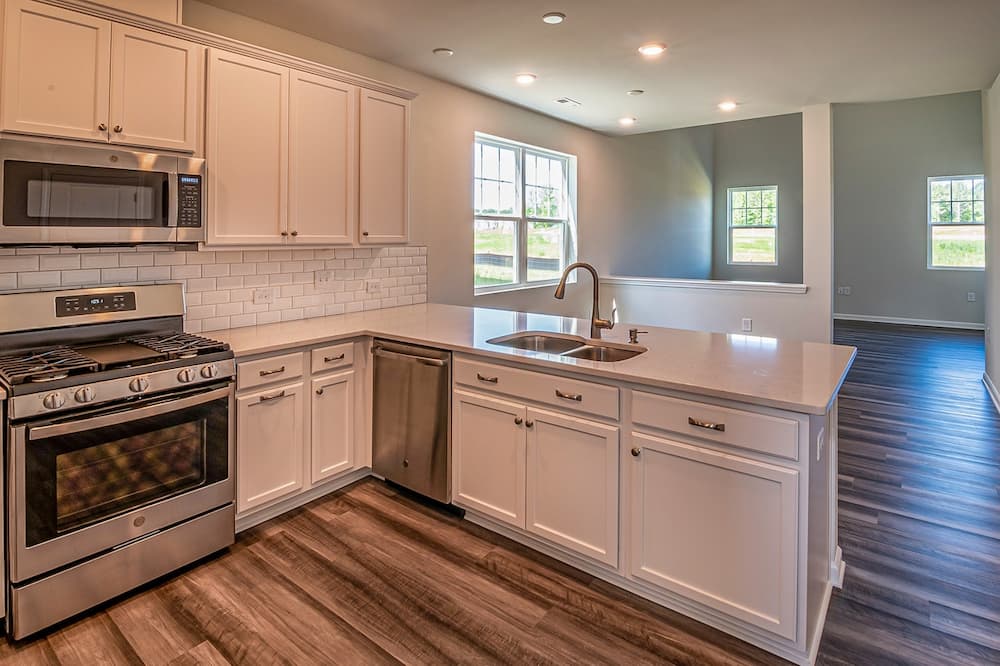 A leaky kitchen faucet is the first of many items on a residential plumbing inspection list