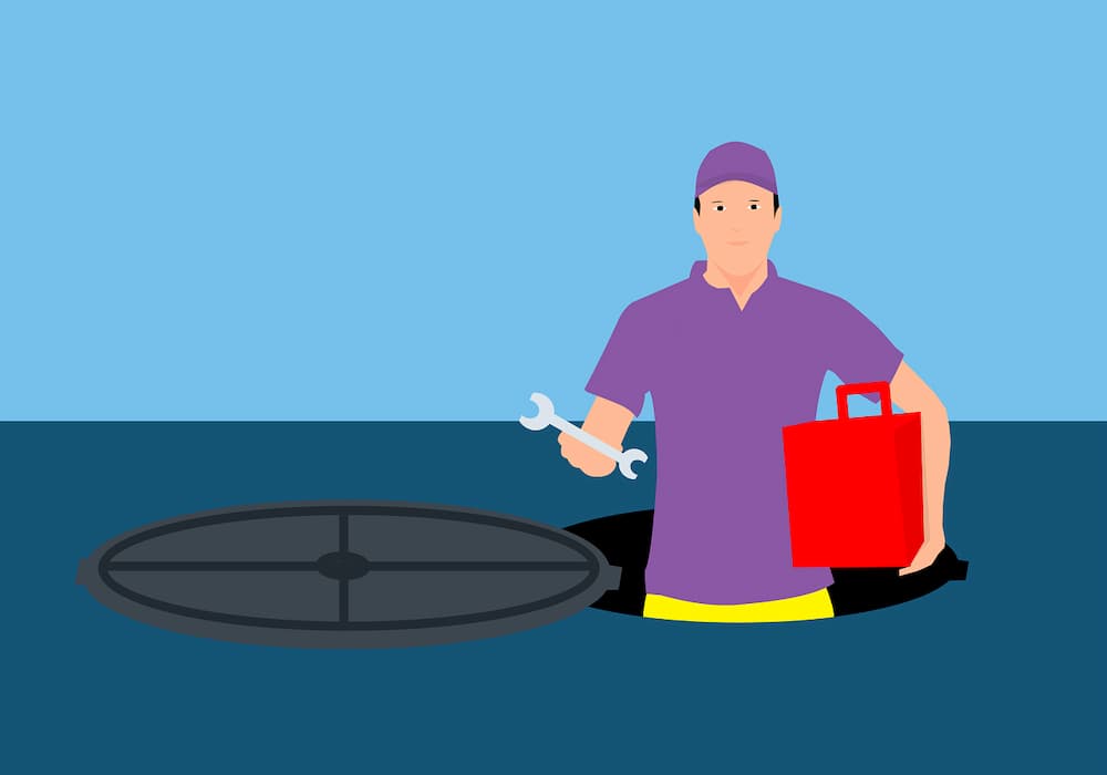 Man in manhole for signs on how to tell if you have a water leak underground